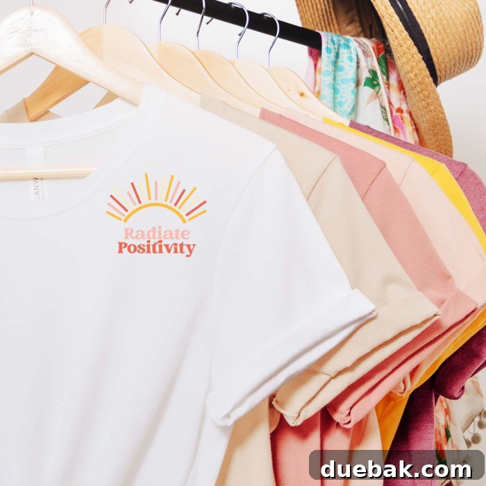 Positive Vibes SVG 4 A collection of shirts in various colors hanging neatly on a clothing rack. The prominent white shirt at the front features the 'Radiate Positivity' SVG design, showcasing arrays of sunshine and the vintage-style text.