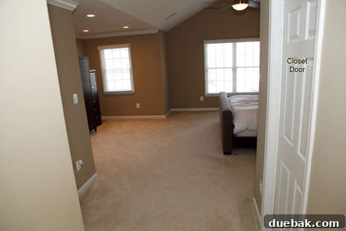 Before: A bare bedroom lacking warmth and character, featuring neutral walls and basic furniture.