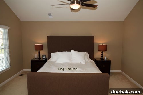 Before: Another angle of the bedroom, showing minimal decor and a need for color and texture.