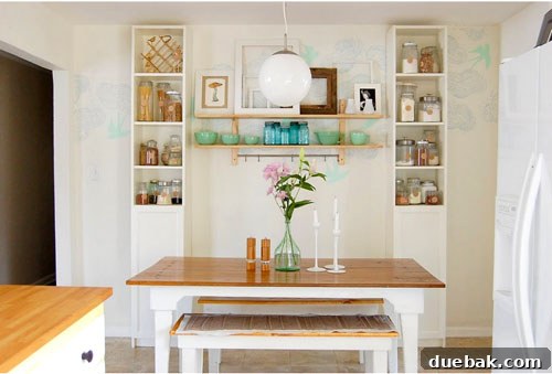 Modern kitchen with open shelving, pendant lights, and carefully chosen decor elements.