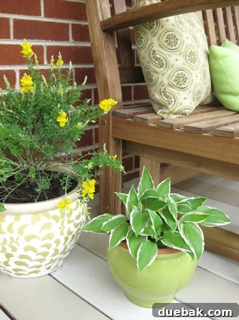 A vibrant outdoor seating area with colorful pillows and potted plants, creating an inviting spring patio space.