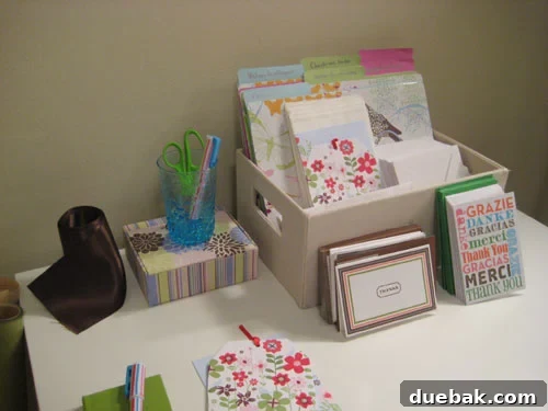 Desk organization with files covered in cheerful floral patterned wrapping paper, adding a spring touch to a home office.