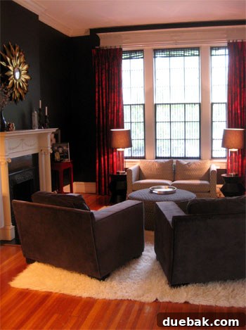 Beyond the Threshold: Lavish Living Revealed, Part Two 12 Stacie's dramatic living room featuring luxurious dark walls, large windows, and ruby red curtains.