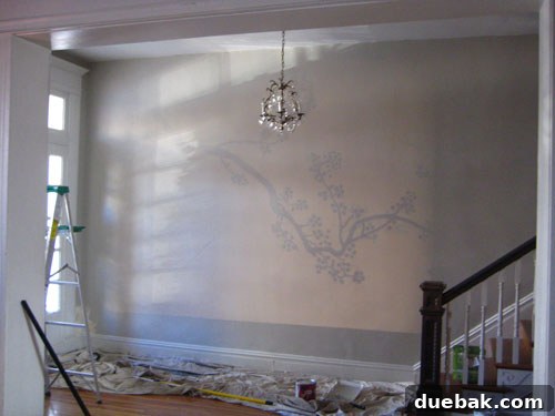 Beyond the Threshold: Lavish Living Revealed, Part Two 14 Cherry blossom mural in progress, showing the design projected onto the entryway wall for tracing.
