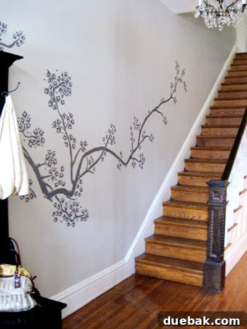 Beyond the Threshold: Lavish Living Revealed, Part Two 19 A stunning overall view of the finished cherry blossom mural flowing up the entryway stairs.