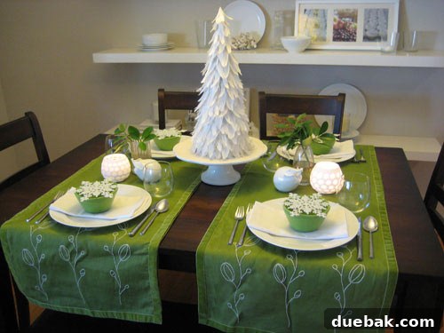Kitchen counter display featuring a cake stand with homemade cupcakes