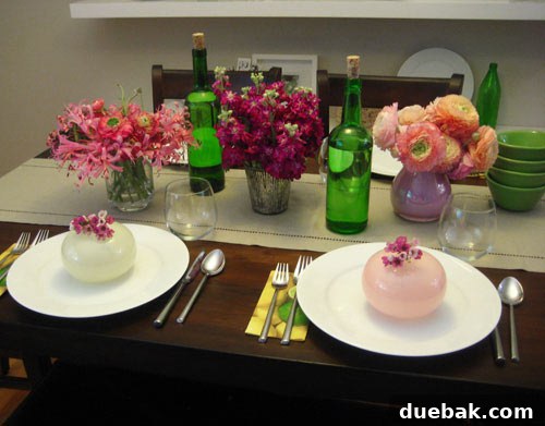 Collection of small colorful vases enhancing a stylish dining table setting