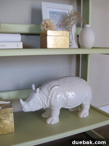 Playful white ceramic rhino statue adding a quirky touch to home decor