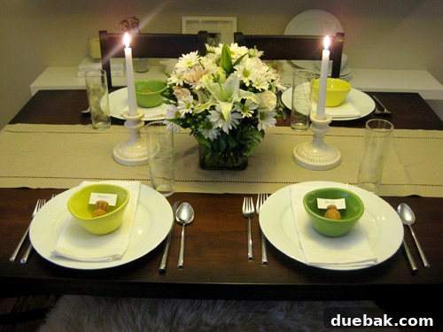 Diverse collection of candlesticks creating an elegant grouping on a table
