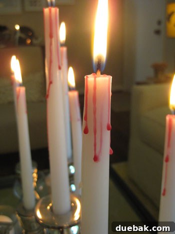 Candlesticks decorated with festive ornaments for Christmas decor
