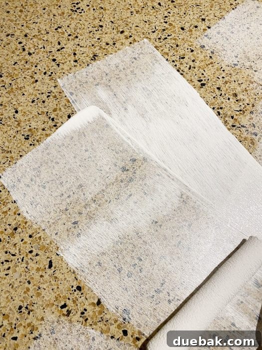 Revamp Your Granite Countertops with Paint 11 First coat of primer applied to the countertop.