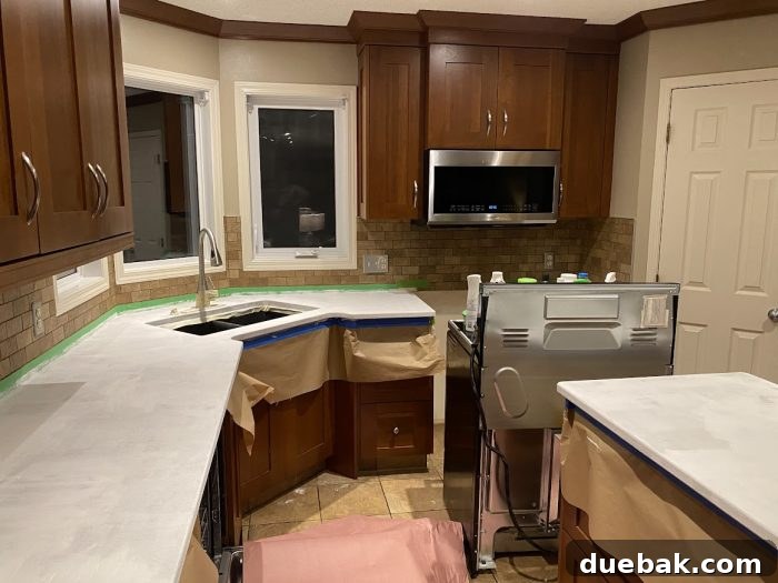 Revamp Your Granite Countertops with Paint 10 Stove pulled out and floor protected for the renovation.