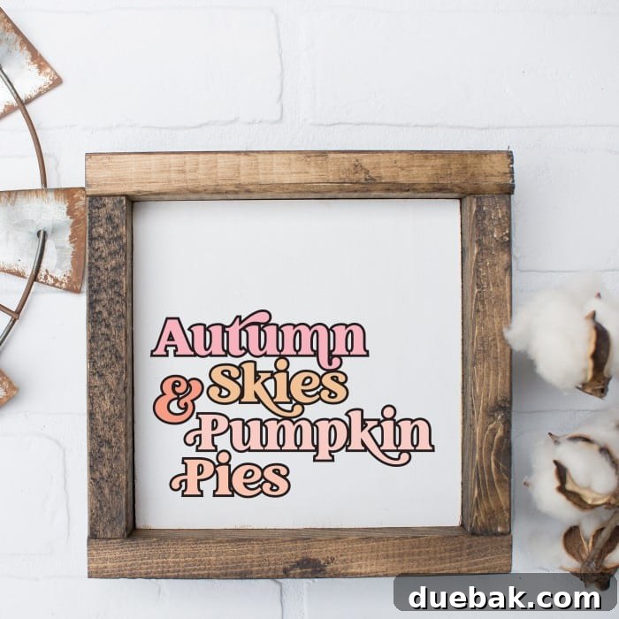 Rustic wood sign featuring 'Autumn Skies & Pumpkin Pies' in elegant pink, gold, and peach lettering, perfect for fall decor.
