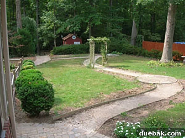 Craigslist Hack: Free Yard Work & Home Labor Made Easy 3 A partially cleared garden with dug-up sections and a person still working.