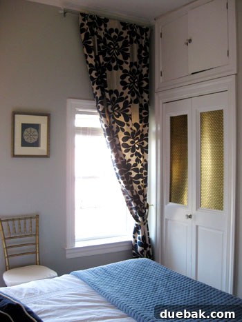 Step Inside This Exquisite City Residence 14 Close-up of a DIY closet door with patterned metal radiator sheet inserts.