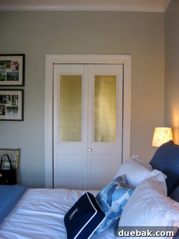 Step Inside This Exquisite City Residence 15 Master bedroom with two balanced closets featuring DIY metal-inserted doors, and stored dining chairs.