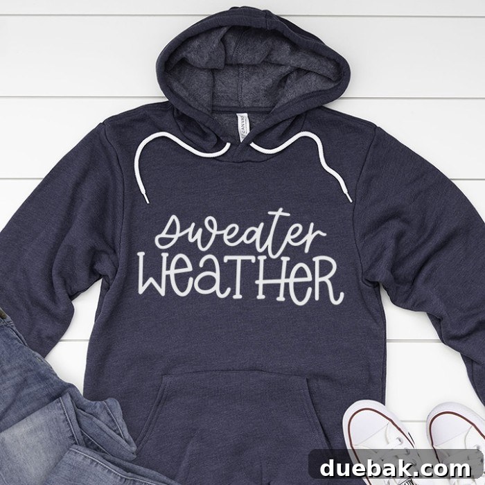 Blue sweatshirt featuring 'Sweater Weather' text with a cozy vibe.