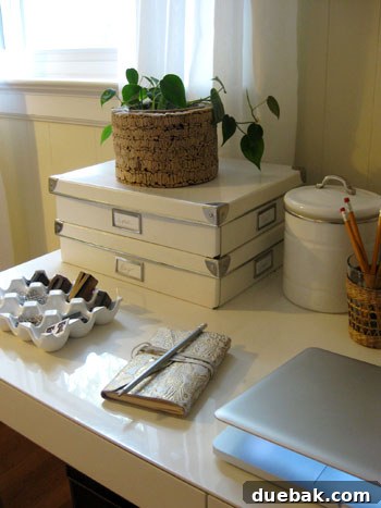 Detailed shot of the ceramic egg crate repurposed as a desk organizer for small supplies.