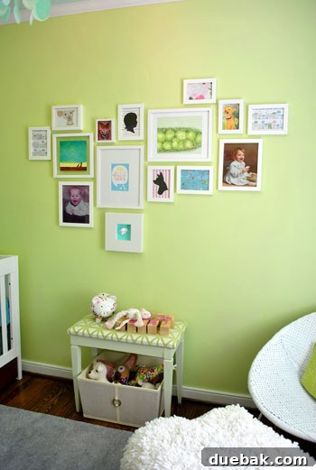 Emerald and Aqua Dreams for Our Girl 21 Nursery art wall featuring a mix of framed prints, photos, and craft paper