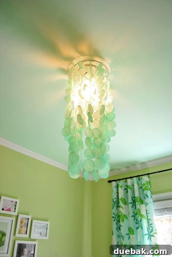 Emerald and Aqua Dreams for Our Girl 5 Close-up of the aqua capiz chandelier hanging in the nursery
