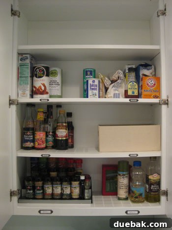 Second organized kitchen cabinet with categories for baking and cooking supplies