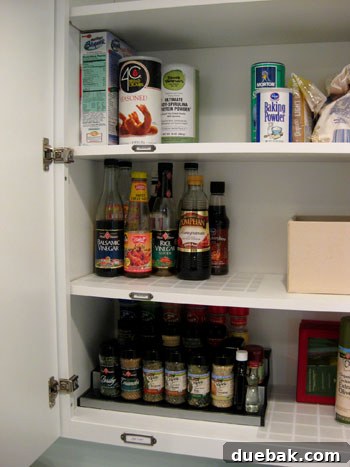 Organized cooking oils and sauces on placemat liners in cabinet