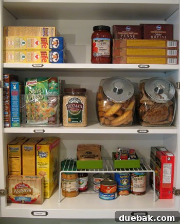 Organized cabinet shelf with metal label for 'Cereal'