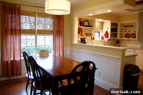Transform Your Kitchen Without Breaking the Bank 7 Panoramic view of the fully renovated open-concept kitchen and dining room, highlighting the improved flow, abundant natural light, and cohesive design elements that unify the two areas beautifully.