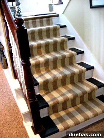 Elegant detail of the jute stair runner secured onto newly painted staircase