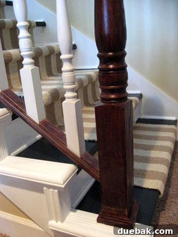 Beautifully renovated staircase showcasing added molding and cohesive design