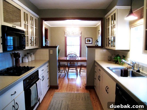Grasscloth & Paint: A Fresh Take on Cabinet Updates 6 Another after shot of the kitchen, showcasing the new window treatment and overall serene aesthetic.