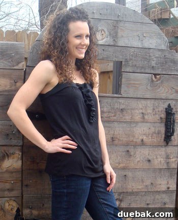 Kara, the homeowner and DIY enthusiast from Made 2 Create, smiling in her beautifully decorated home.