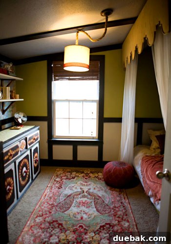 Exotic and worldly reading room with a cozy bed nook, a Moroccan-inspired repainted dresser, and global decor.