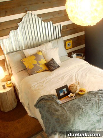 Rustic yet glamorous guest bedroom with a DIY corrugated tin headboard, metallic accents, and a DIY overhead light.