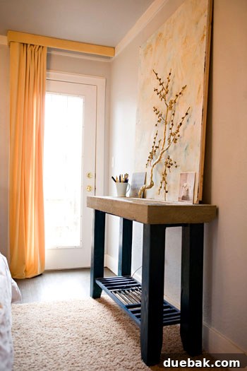 Main bedroom with a new glass door opening to a private outdoor area, increasing light and outdoor access.