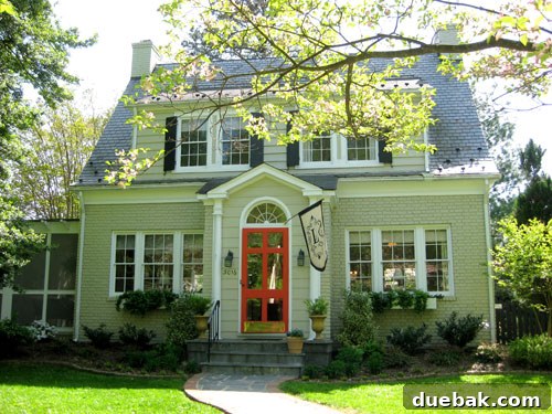 Bright & Beautiful Homes 2 Charming Westover Hills home exterior with a welcoming front porch, lush landscaping, and classic architectural details, hinting at the bright interiors within Richmond, VA.