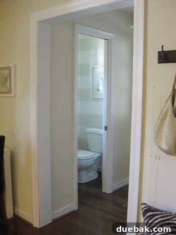 Elevate Your Small Home The Power of Cohesive Flooring 9 Bedroom with rich, dark hardwood flooring