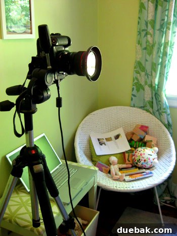 Behind-the-scenes photoshoot setup with camera connected to computer