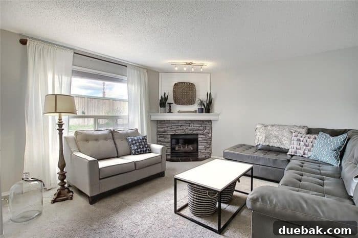 Stone corner fireplace with whitewashed stone and shiplap to fill in the awkward space above the TV. 