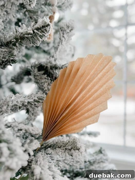 Paper palm in a Christmas tree for boho style holiday decor.