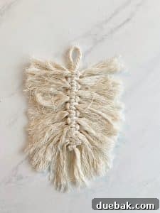 Simple macrame cords showing the process of how to make a macrame feather