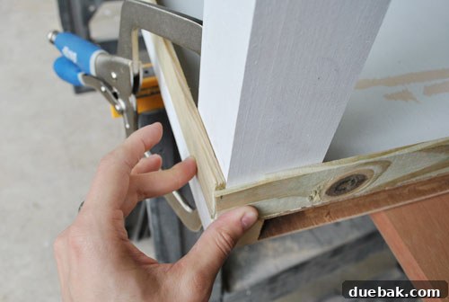 From Door to Desk: Craft Your Perfect DIY Workspace 15 Attaching a desk leg to the door with a clamp and guide
