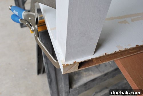 From Door to Desk: Craft Your Perfect DIY Workspace 16 Desk leg securely screwed in place