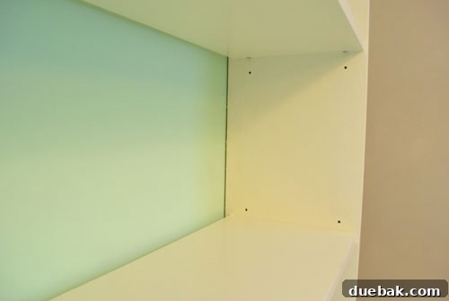 Shelf pin holes filled with caulk, creating a cleaner look
