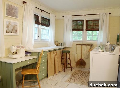 Bright and airy laundry room with painted white brick walls and sage cabinets