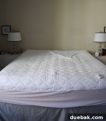 Craft Your Own Arched Headboard 2 Elizabeth's beautiful custom upholstered headboard in a charming bedroom setting.