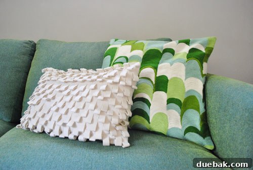 Elevate Your Workspace: Desk Wall Art 5 West Elm pillow with an arched pattern