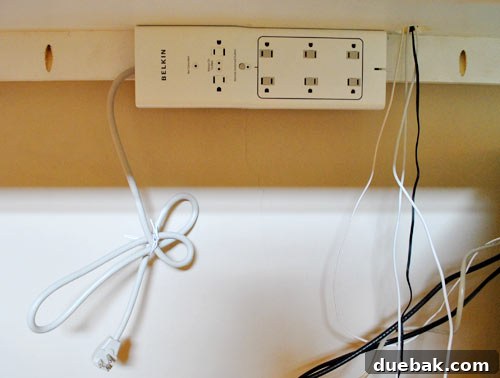 Untangle Your Tech Cables 13 Mounted Belkin Conserve surge protector under the desk