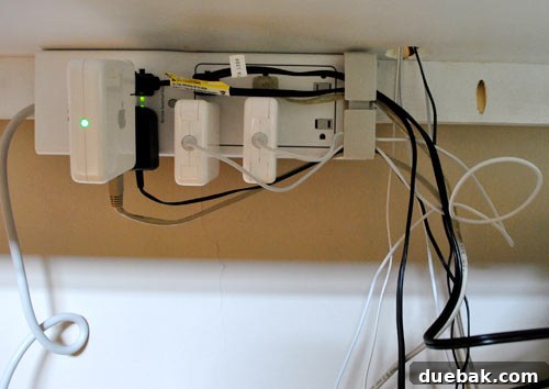 Untangle Your Tech Cables 14 Initial mess of cords after plugging into the mounted surge protector