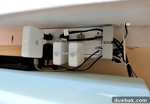 Untangle Your Tech Cables 17 Cords bundled with a twist tie near a storage shelf